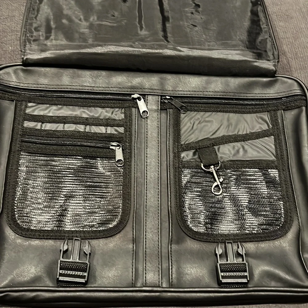 Briefcase, Black, Handles and Shoulder Straps lots of storage.